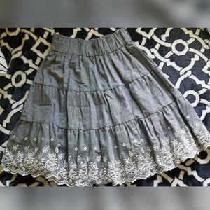 Grey skirt with white embroidery details